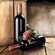 2 bottles of wine with grapes